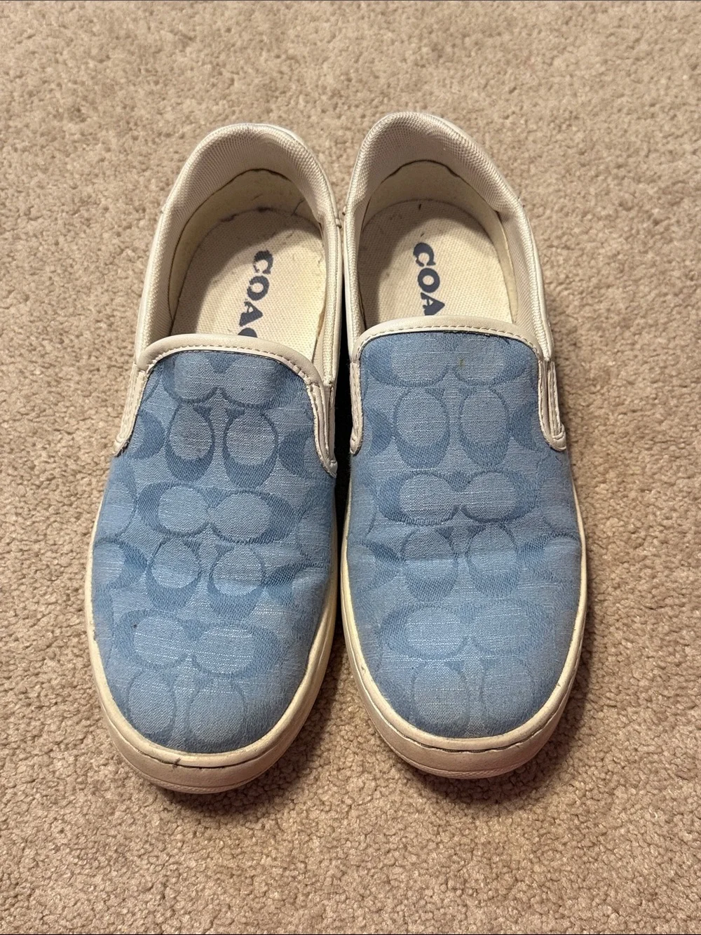 Coach Light Blue Signature Slip-On Sneakers with White Trim.